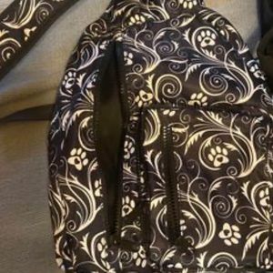 Paw print sling backpack excellent condition